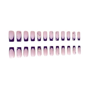 Purple French tip press-on nails with silver butterfly charms and rhinestones