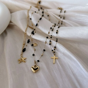 Elegant gold starfish heart and cross pendant necklace with black agate beads on silk