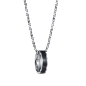 Minimalist silver stainless steel necklace with black ring pendant on white background