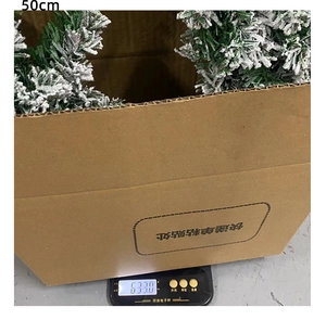 50cm snow-flocked Christmas wreath PVC decoration weighed on an electronic scale