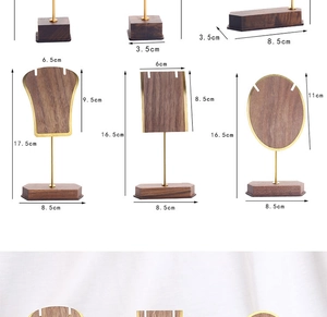 Macro view of walnut wood base and gold metal jewelry stand with precise size marking