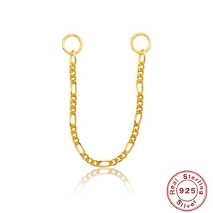 Macro detail of 925 sterling silver gold chain connector with polished jump rings