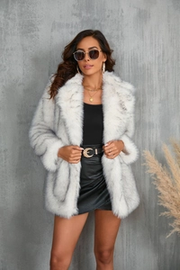 Close-up of white and grey striped faux fur coat with oversized lapel on female model