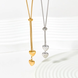 Polished double heart pendant necklace in gold and silver finish with adjustable slider chain