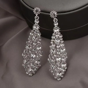 Sparkling silver needle drop earrings with irregular crystal rhombus mesh on silk cloth