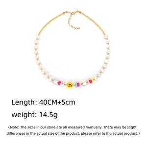 Handmade freshwater pearl necklace with colorful beads and yellow smiley face charm