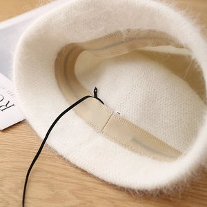 White angora wool blend bucket hat with adjustable interior drawstring and soft inner lining