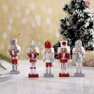 Set of 5 glittery wooden Christmas nutcracker figurines with silver and red holiday details