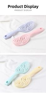 Detail of four macaron-colored vented hair brushes with spiral hollow design and hang holes