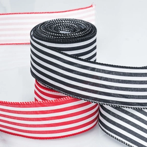 Faux linen striped Christmas ribbons in red, black, and white for DIY holiday decor