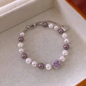 Vintage pearl bracelet featuring purple square zircon and initial K tag in velvet box