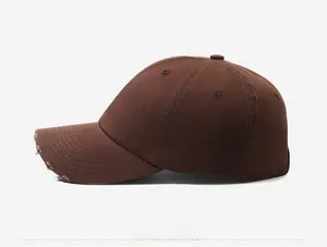 Side view of dark brown washed cotton baseball cap with vintage distressed brim details