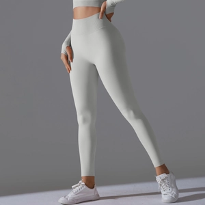 Close-up of high-waisted fitness leggings showing seamless matte fabric and contouring lines