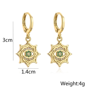 Detailed size view of gold star evil eye earrings with green zircon and 3cm height