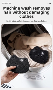 Close-up of black cat shaped washing machine sponge filtering hair and lint from clothes
