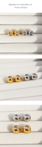 Detail view of round cubic zirconia stud earrings in gold and silver finish sets