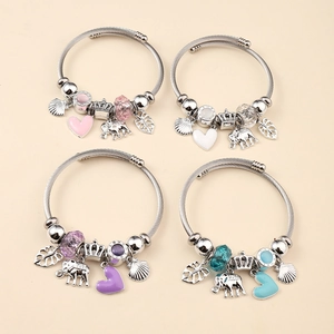 Detail view of four adjustable wire charm bracelets with heart and elephant pendants