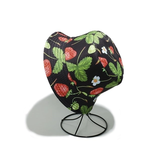 Detail of black bucket hat featuring cute strawberry and floral prints on canvas material