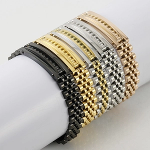 Five assorted stainless steel watch bands in gold and silver finish on a display stand