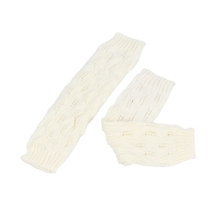 Close-up of cream knit leg warmers featuring hollow leaf patterns and cable texture
