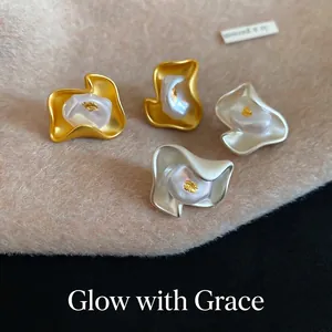 Irregular matte flower stud earrings with pearls and gold leaf in gold and silver