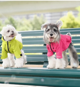 Detailed view of waterproof pet raincoat with adjustable cuffs and hood for dogs