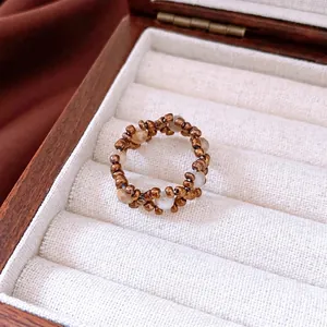 Vintage stone and glass beaded elastic ring with bronze beads and white mineral stones