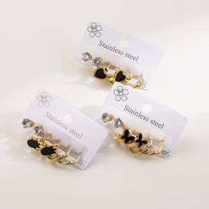 Three-set stainless steel heart and butterfly hoop earrings in gold and black enamel