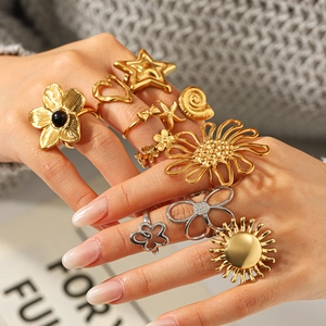Bohemian gold and silver ring set featuring sun, flower, and star motifs for women