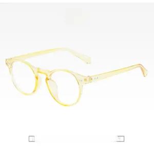Detail of yellow round transparent anti-blue light glasses frames with clear resin finish