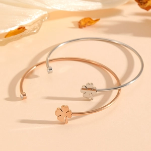 Adjustable stainless steel clover bangle with sparkling crystal in gold and silver