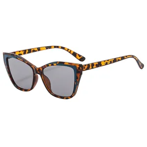 Chic cat-eye tortoiseshell sunglasses with dark gray lenses in a stylish 45-degree side view
