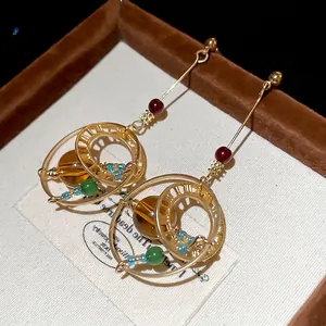 Vintage bohemian style crystal circular drop earrings with golden alloy and amber beads