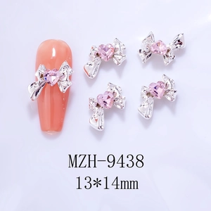 Detail of silver bow nail charms with pink heart crystal and 13x14mm size marking