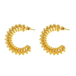 Detailed view of 18K gold plated spiral spring hoop earrings with polished metal finish