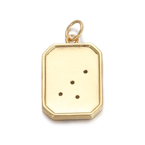 Detailed macro view of a gold rectangle pendant with star constellation engraving