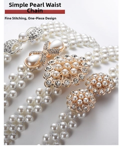 Macro shot of faux pearl woven belt with rhinestone bow buckle and elegant metal hardware