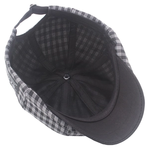 Inside view of black and white checkered newsboy cap with adjustable sweatband