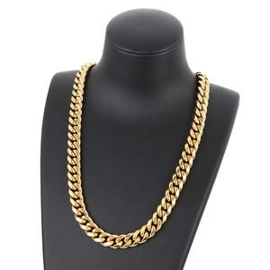 Classic golden stainless steel Cuban link necklace for men on a black model bust
