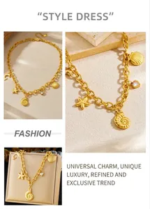 Macro detail of gold sea star shell and dolphin pendants on thick chain necklace