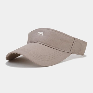Detail of khaki sun visor featuring fine white bear embroidery on cotton twill fabric
