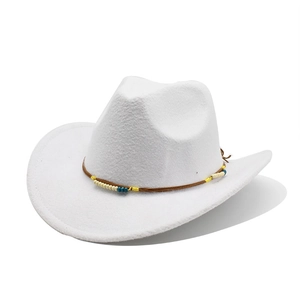 Close-up of white felt cowboy hat featuring bohemian beaded band and wide curved brim