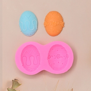 Detail view of pink silicone Easter egg mold with floral and wave patterns for DIY baking