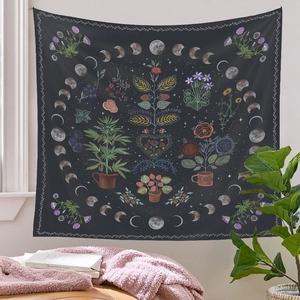 Detail of bohemian tree of life tapestry with moon phases and potted plants in home setting