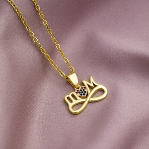 Close-up of gold Mom necklace with infinity symbol and multi-color heart gemstone