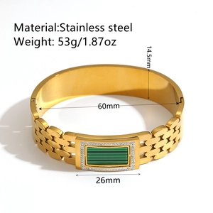 18K gold plated stainless steel bangle with green stone and diamonds on white background