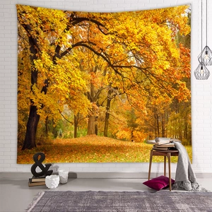 Detail showing autumn forest landscape tapestry hanging on a modern white brick wall