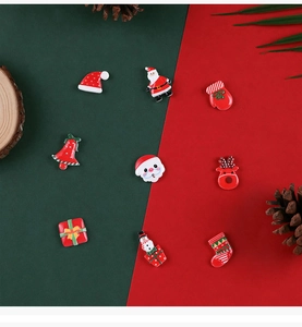 Assorted Christmas resin charms featuring Santa, reindeer, and bells for DIY crafts