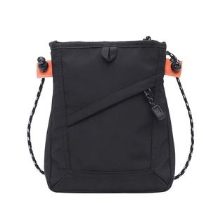 Black nylon crossbody bag with orange accents and woven rope strap on white background