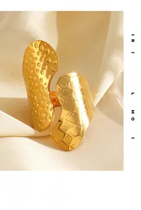 Macro view of 18K gold plated wide ring featuring hammered and scale texture details